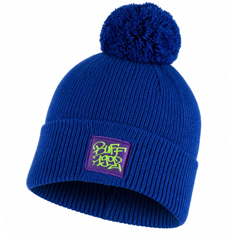 Topla otroška pletena kapa BUFF® JR Knitted Hat Deik Azure v azurno modri barvi, izdelana iz 70 % akrila in 30 % recikliranega poliestra, z zavihanim robom in dekorativnim cofom za hladne jesenske in zimske dni.