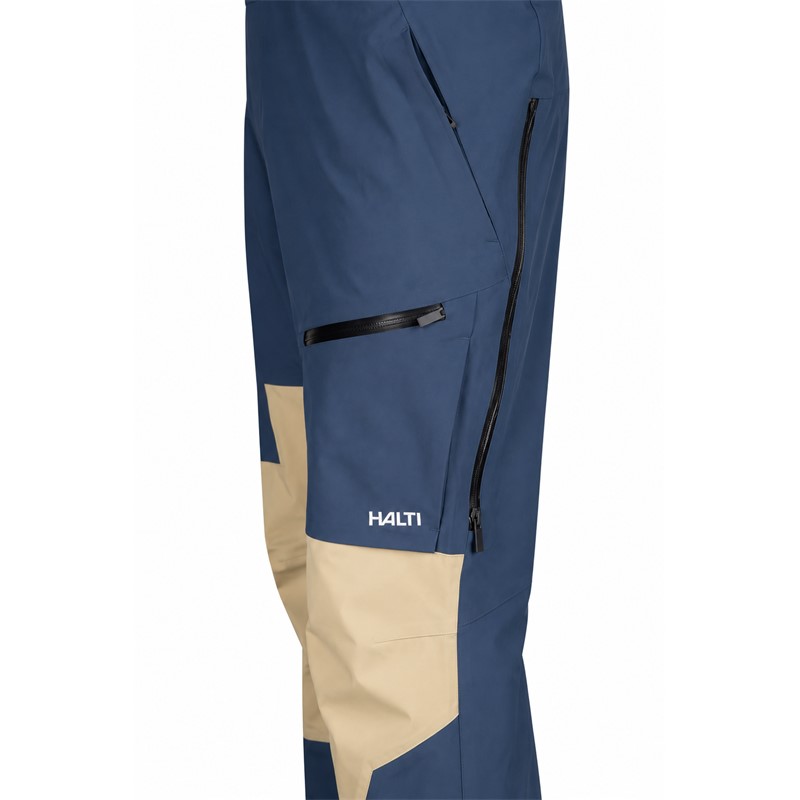 Unisex smučarske hlače HALTI Rizle 3L DX Sargasso Sea Blue v modri barvni kombinaciji G36. Napredna trislojna membrana DrymaxX Nano zagotavlja vodni stolpec 25.000 mm in zračnost 20.000 g/m²/24 h. Hlače imajo visok oprsnik, nastavljive naramnice, dvosmerno sprednjo zadrgo, prezračevanje, prostorne žepe, anatomsko oblikovana kolena, ojačitve Stretch Cordura in notranje snežne gamaše.